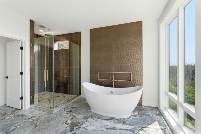Primary bathroom with tub and shower